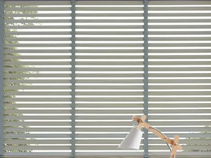 Close-up of horizontal Venetian slats and their ladder cords